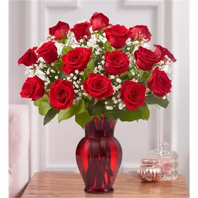 Sometimes flowers speak louder than words…and our elegant red roses speak volumes! Beautifully hand-arranged with lush greenery inside our exclusive ruby red vase, each radiant bloom will help you express your love in the most romantic way possible. All-around arrangement with premium red roses, baby’s breath and greens Our florists select the freshest flowers available, so colors and varieties may vary due to local availability