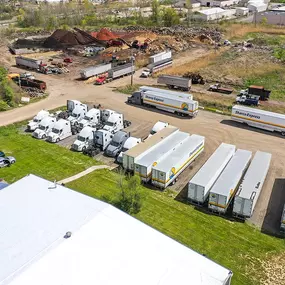 Sharco Express trucking yard with parked trailers, sprinter vans, and trucks