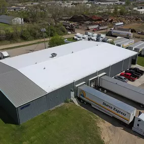 Sharco Express warehouse facility with loading docks and trailers