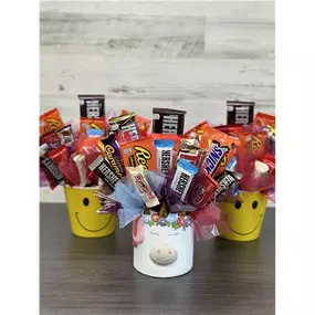 Let us design a tasty treat! Celebrate any occasion with a beautiful assorted chocolate candy bouquet. It's eye-catching and tasty! Celebrate their smile! *Candy and container will vary by season and local availability!