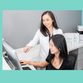 Dr. Tran and receptionist at Mint Dental Loft