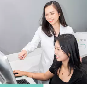 Dr. Tran and receptionist at Mint Dental Loft