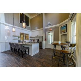 Stunning Modern Design Community Clubhouse with Ample Space and Amenities like Coffee Bar and Fireplace Lounge at Legacy Farm Apartments