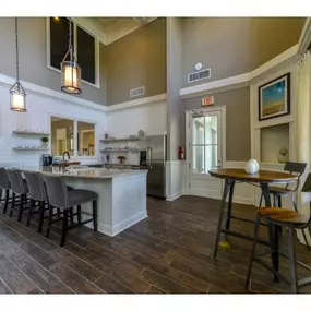 Stunning Modern Design Community Clubhouse with Ample Space and Amenities like Coffee Bar and Fireplace Lounge at Legacy Farm Apartments