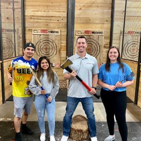 Celebrating our team success with axe-throwing