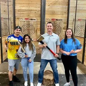 Celebrating our team success with axe-throwing