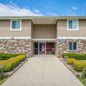 Property Exterior of Glen Hills Apartments, Multi-Level Property With Entrance and Lush Landscaping