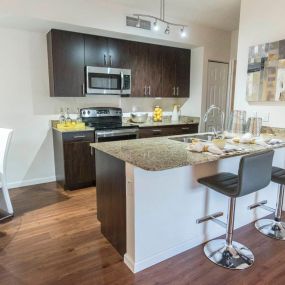 Gorgeous Kitchens Complete with Designer Finishes, Modern Appliances, Granite Countertops and Large Island at Casa Brera at Toscana Isle Apartments