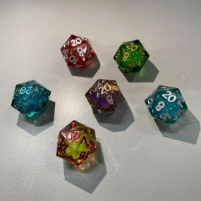 Liquid core dice.  Little mini snow globe to sparke up your rolls. Come see them in person!