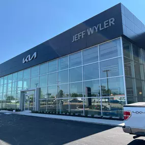 Exterior of Jeff Wyler Kia of Colerain featuring dealership signage, highlighting a trusted Kia dealership serving Colerain and the Cincinnati area.