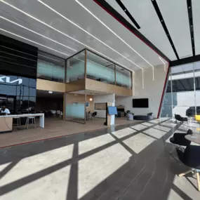 Lobby of Jeff Wyler Kia of Colerain in Colerain, OH, offering a comfortable customer lounge where drivers can relax while shopping new Kia vehicles, browsing pre-owned inventory, or waiting for service.