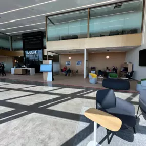 Lobby of Jeff Wyler Kia of Colerain in Colerain, OH, offering a comfortable customer lounge where drivers can relax while shopping new Kia vehicles, browsing pre-owned inventory, or waiting for service.