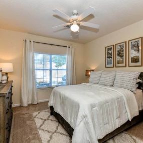 Spacious Bedroom with Large Walk-In Closets & Ceiling Fans at Legends at Charleston Park Apartments,