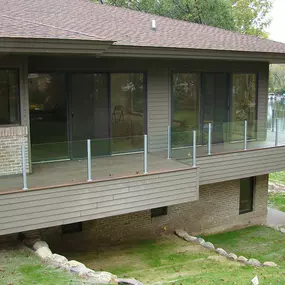Upgrade your deck with Falcon glass railing installation by Cedar Works in Commerce Charter Twp, MI. Perfect for residential homes, our glass rail systems deliver a sleek, unobstructed view while maintaining safety and sophistication. Enjoy clean lines, premium materials, and flawless craftsmanship built to impress.