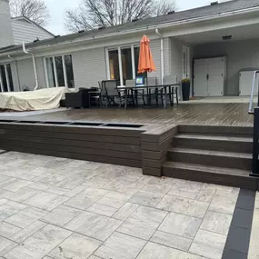 Spacious low-profile composite deck with outdoor seating, integrated steps