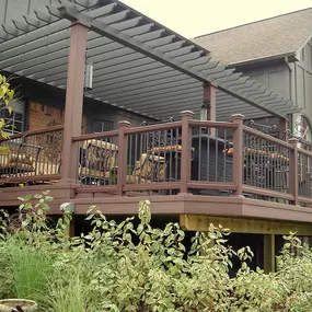 Cedar Works brings shade and sophistication together with this custom pergola over a luxurious deck in Commerce Charter Twp, MI. Crafted with premium materials and expert detailing, the pergola enhances outdoor comfort while adding architectural elegance to this upscale deck design.