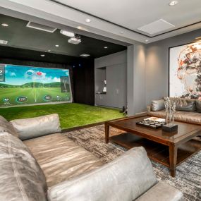 Play games on the golf and game simulator at Camden Central Apartments in St. Petersburg, FL.
