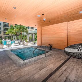 A total spa-like experience when you visit the community spa area with hot tub, sauna and steam room at Camden Central Apartments in St. Petersburg, FL.