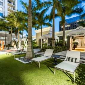 Lovely cabanas and pool loungers at dusk at Camden Central Apartments in St. Petersburg, FL.