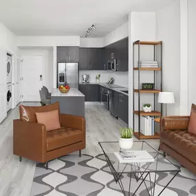 Living room and kitchen in Da Vinci floor plan at Camden Central high-rise apartments in St. Petersburg, FL