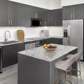 The kitchen at Camden Central apartments in St Petersburg, Florida features a beverage refrigerator.