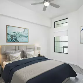 The penthouse bedroom features high ceilings and an LED ceiling fan at Camden Central apartments in St Petersburg, Florida.