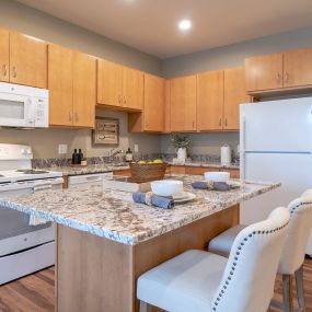 Fully Equipped Kitchen with an Island at Bren Road Station