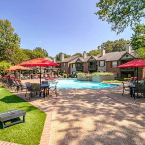 Inviting Swimming Pool with Fountain and Sundeck with Lounge Chairs and Tables for Relaxing at The Edge of Germantown Apartments Home