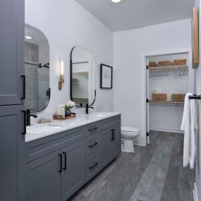Double vanity sinks with entry to walk in closet