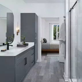 Bathroom with single sink and walk-in shower at Camden Durham apartments in Durham, NC