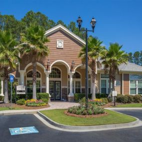 Lush landscaping surrounds you as you drive into Courtney Bend Apartment Homes