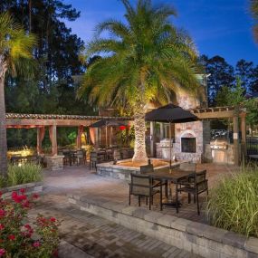 Enjoy Our Pool Deck with Patio and Chairs at Courtney Bend Apartment Homes