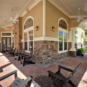 Pool Deck with Patio and Chairs at Courtney Bend Apartment Homes