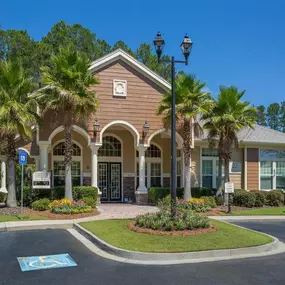 Lush landscaping surrounds you as you drive into Courtney Bend Apartment Homes