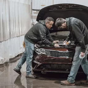 Collision Leaders vehicle experts inspecting a vehicle before returning it to the customer.