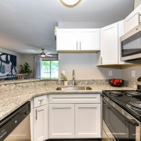 Kitchen with granite countertops and stainless steel appliances at 15Seventy, Chesterfield