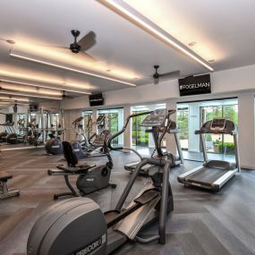 Renovated fitness studio with cardio and weight lifting equipment at 15Seventy