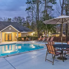 Enjoy Our Pool Deck with Patio and Chairs at Addison on Cobblestone Apartment Homes