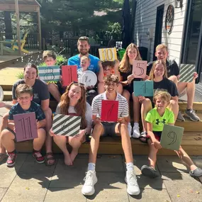 In honor of Grandparents' Day, here is a picture of my family that we took last weekend.  We all got together to celebrate my dad.  He's retiring from State Farm after 47 years.  When we asked how he wanted to celebrate, he told us he wanted us all together.  So that's what we did.  All 23 of us (3 kids with spouses, 11 grandkids and 1 great) spent the long weekend together.  
We did all the things we did as kids.  We had homemade pizza using Dad's recipe, played golf, swam, had Dad's pancakes, 