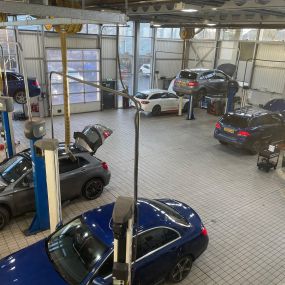 Cars inside the Mercedes Ben of Ayr service centre workshop