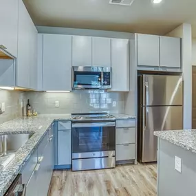 Kitchen with Stainless steel appliances The Beck at Hidden River Apartments