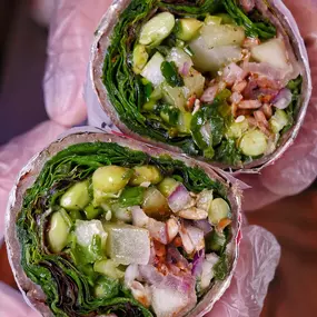 Ghost: Quinoa and sunflower seed wrapped in whole wheat dough with grilled portobello, shallot, edamame, scallion, zatar and citrus sumac vinaigrette. Filled with mixed greens