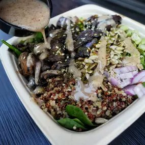 Ghost: Quinoa and sunflower seeds with grilled portobello, shallot, edamame, scallion, zatar and citrus sumac vinaigrette. Filled with mixed greens