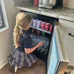 I had the cutest helper in the office this afternoon! She restocked the complimentary beverages for our customers