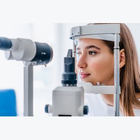 Female patient getting a vision exam.