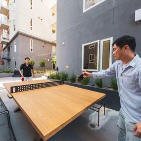 Outdoor ping-pong at Fedora x Trilby Apartments in Los Angeles, CA 90005