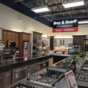 Bray & Scarff kitchen appliance showroom floor with dishwashers, cooktops, and refrigerators on display