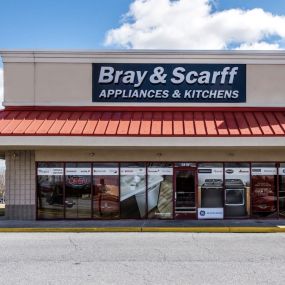 An outside view of the Bray & Scarff appliance store with a red roof located in Frederick, MD