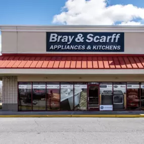 An outside view of the Bray & Scarff appliance store with a red roof located in Frederick, MD