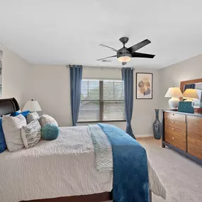Bedroom with a bed and a ceiling fan
